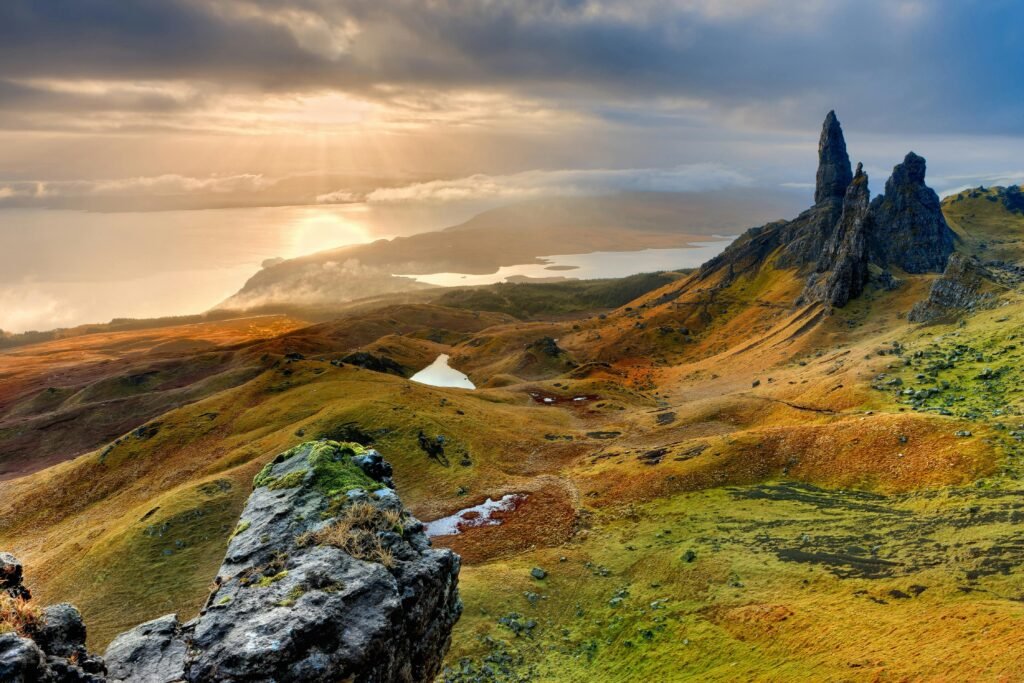 Stunning sunrise at Old Man of Storr in Scotland, highlighting rocky peaks and lush landscapes.