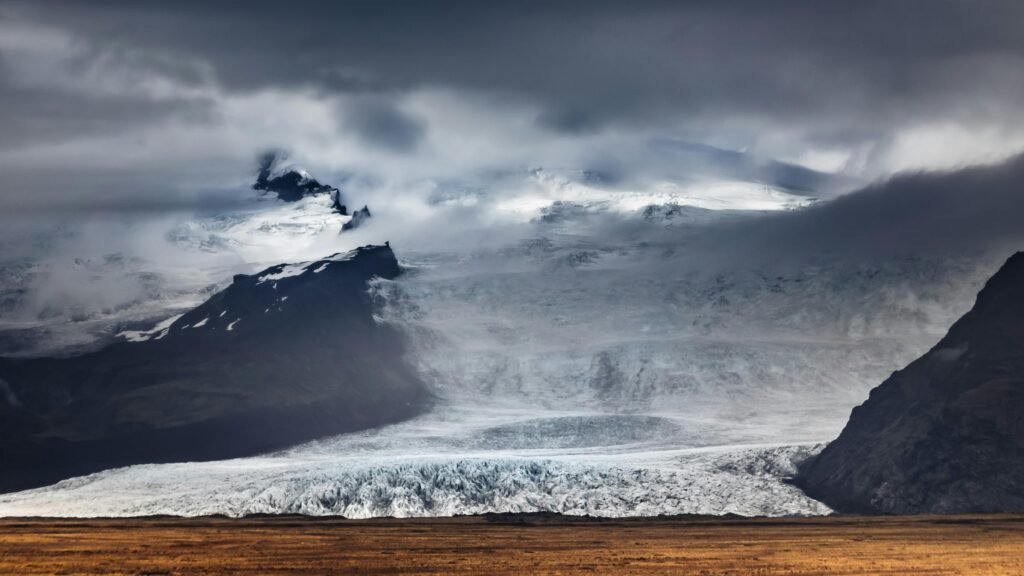Captivating view of Iceland's glacier landscape under moody atmospheric skies.
