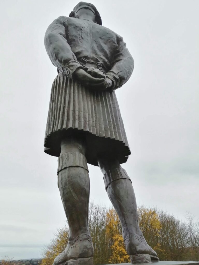 Aerial view of the William Wallace statue in Dundee, representing Scottish heritage with a kilt.