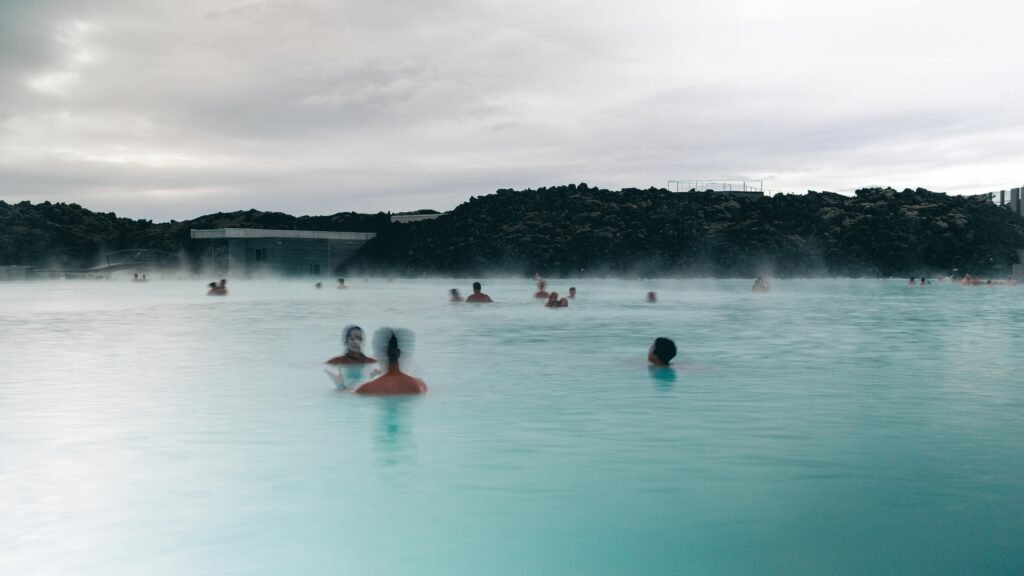People enjoying relaxation and recreation in Iceland's soothing Blue Lagoon geothermal spa.