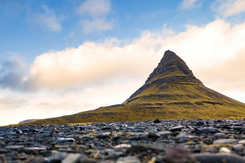 Dramatic landscape of Kirkjufell mountain under a vibrant sky, Iceland's iconic peak.