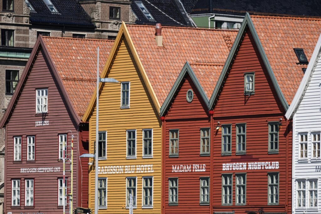 Iconic colorful wooden houses at Bryggen Wharf in Bergen, Norway, showcasing Nordic architectural style.