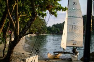 Small sailboat on a serene beach at Koh Chang, Thailand, perfect for a tropical getaway.