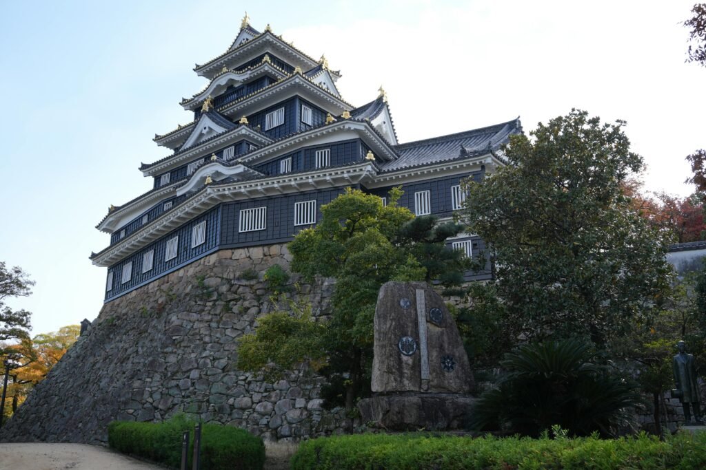 Discover Okayama Castle, a historic Japanese architectural marvel surrounded by lush greenery.